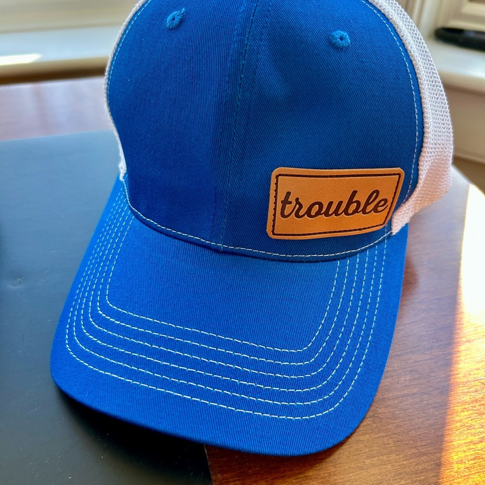 🆕 Blue and White Trucker Hat with Trouble Patch